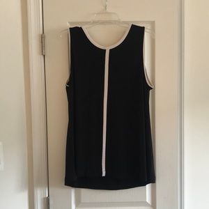 Premise studio black sleeveless blouse with white stripe.